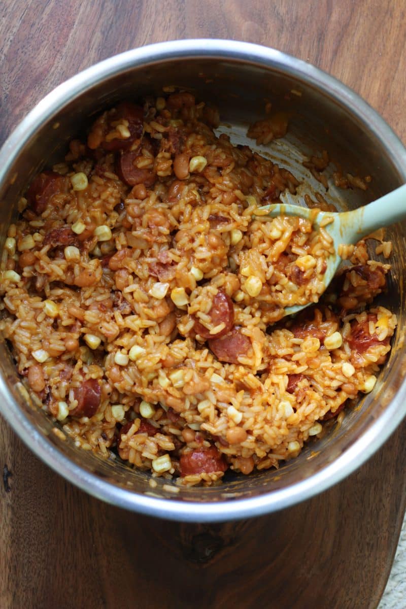 Homestyle Cowboy Beef & Rice Heaven--an Instant Pot dinner made with smoky sausage, pork and beans, corn, bacon and cheddar cheese for an easy meal packed with savory flavor.