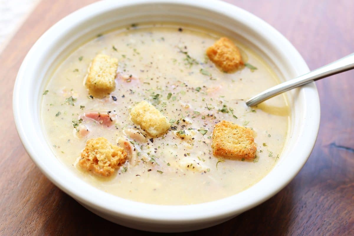 Monte Cristo Soup--an Instant Pot cheesy soup made with ham, turkey or chicken, Swiss cheese, cheddar and Dijon mustard, then topped with crunchy croutons and raspberry preserves.