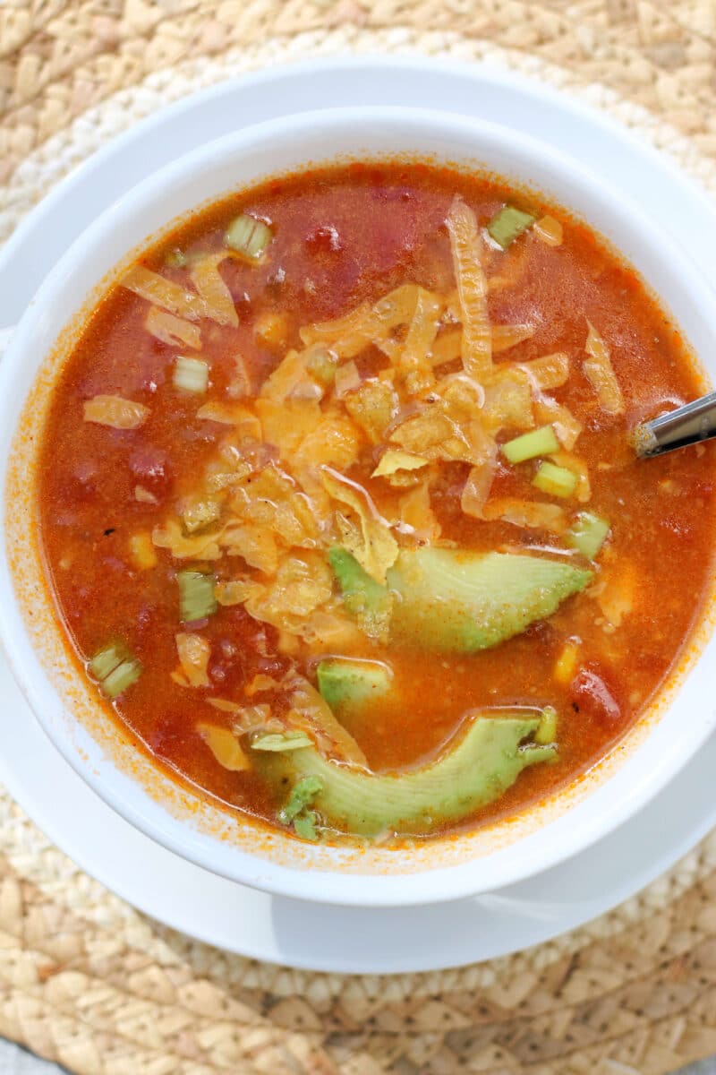 California Pizza Kitchen's Sedona Tortilla Soup--a flavorful soup inspired by the restaurant made with tomatoes, corn, jalapeño, garlic and tortilla chips that cook right into the broth, with optional chicken for extra protein.