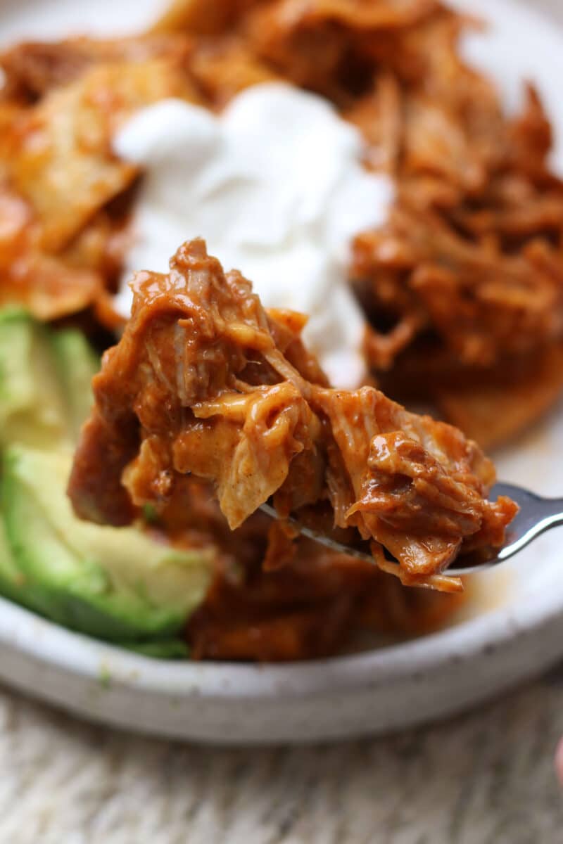 An easy 4-ingredient dinner with tender shredded pork, enchilada sauce, soft tortillas and melty cheese.