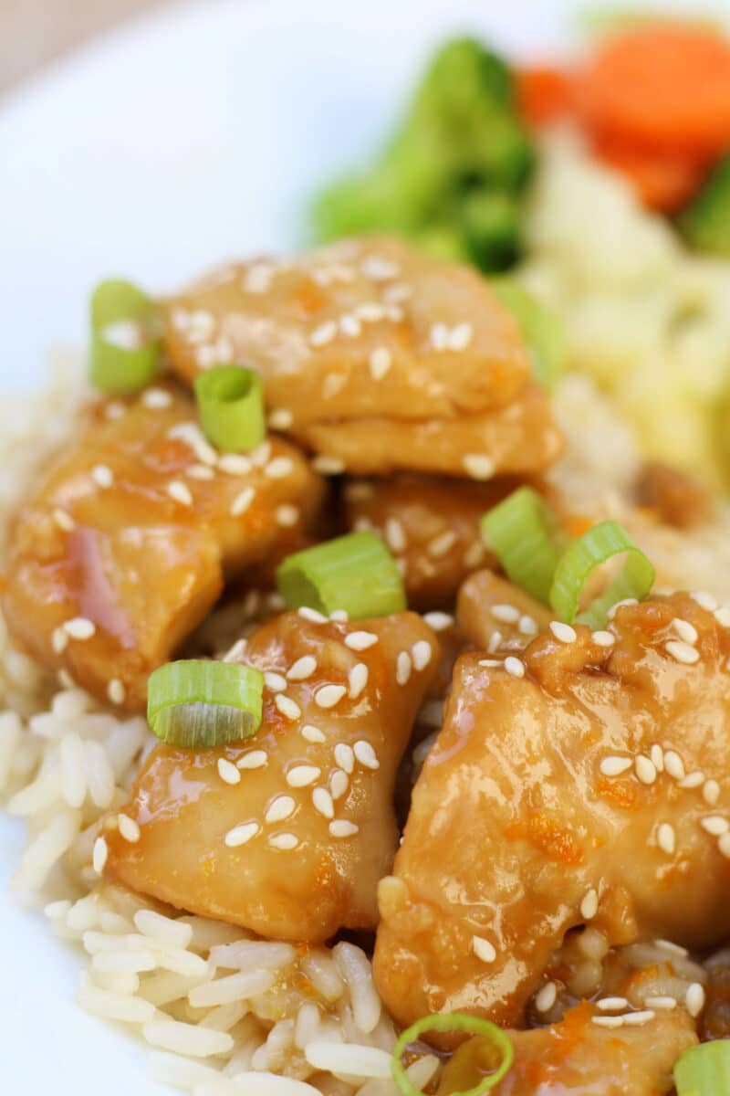 Hayden's California Orange Chicken--an easy slow cooker dinner made with tender chicken thighs, fresh orange juice, ginger and garlic for a simple, flavorful take on orange chicken.