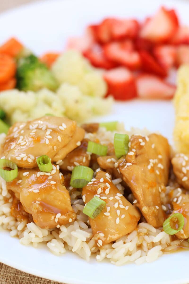 Hayden's California Orange Chicken--an easy slow cooker dinner made with tender chicken thighs, fresh orange juice, ginger and garlic for a simple, flavorful take on orange chicken.