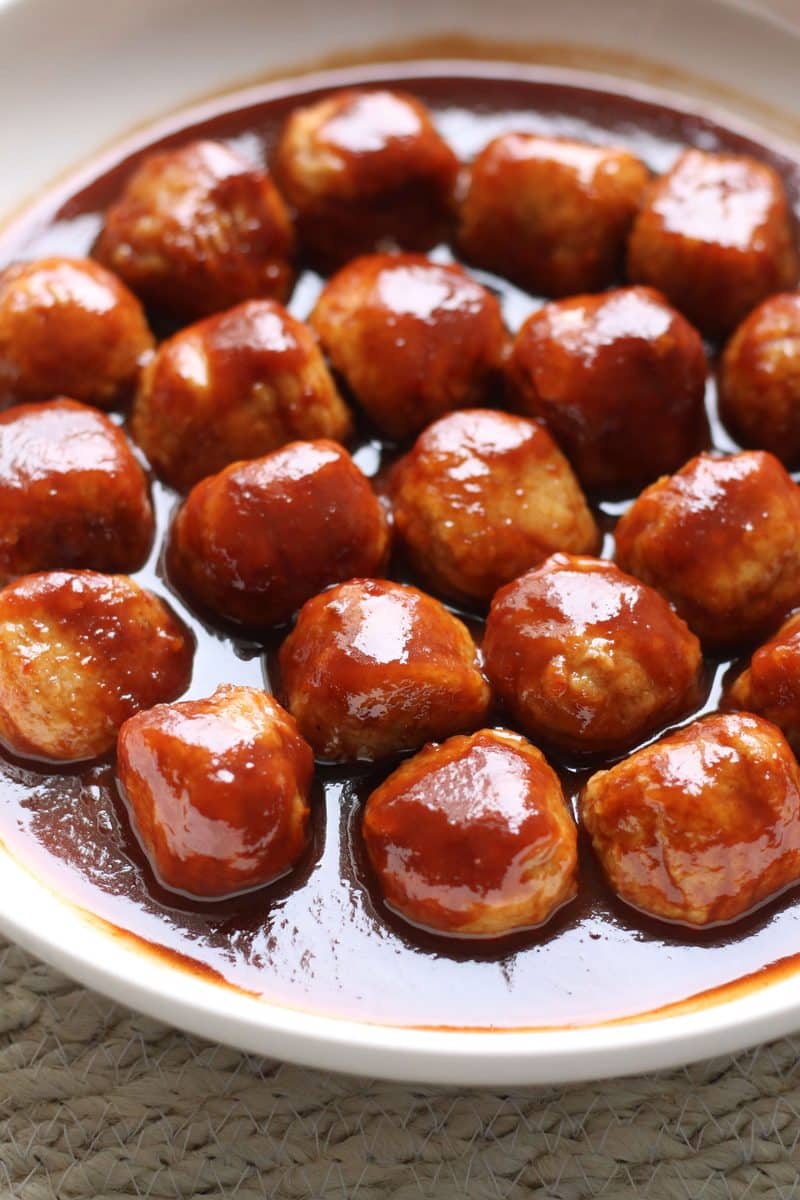 Slow Cooker Honey Balsamic Meatballs--an easy slow cooker appetizer made with only 4 ingredients! Frozen meatballs are tossed in a sweet and tangy sauce made with honey, balsamic vinegar and ketchup.