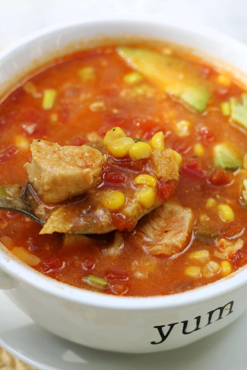 California Pizza Kitchen's Sedona Tortilla Soup--a flavorful soup inspired by the restaurant made with tomatoes, corn, jalapeño, garlic and tortilla chips that cook right into the broth, with optional chicken for extra protein.