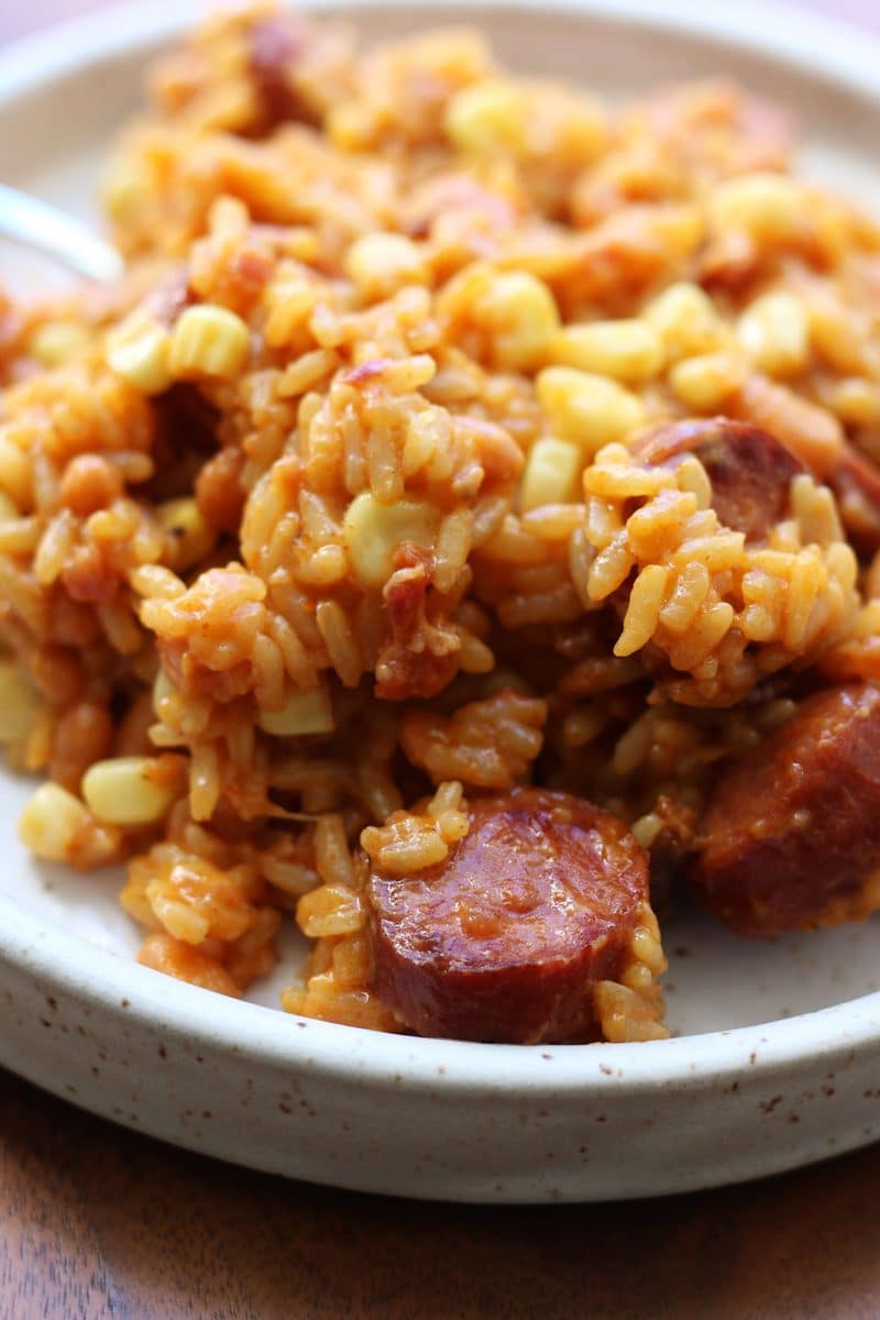 Homestyle Cowboy Beef & Rice Heaven--an Instant Pot dinner made with smoky sausage, pork and beans, corn, bacon and cheddar cheese for an easy meal packed with savory flavor.
