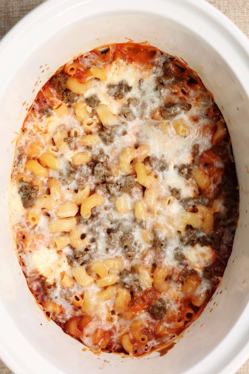 Crock Pot Million Dollar Pasta--an easy crockpot dinner made with ground beef, cavatappi pasta, spaghetti sauce and a creamy layer of cream cheese, sour cream and ricotta.