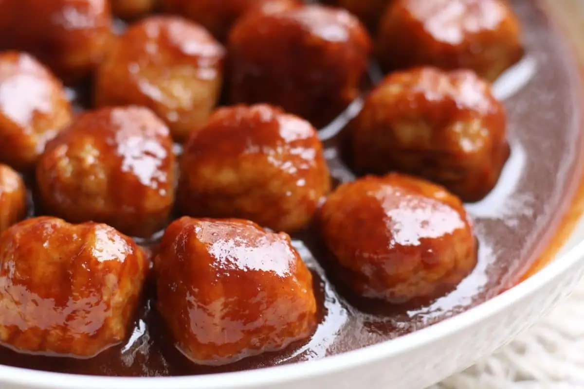 Slow Cooker Honey Balsamic Meatballs--an easy slow cooker appetizer made with only 4 ingredients! Frozen meatballs are tossed in a sweet and tangy sauce made with honey, balsamic vinegar and ketchup.