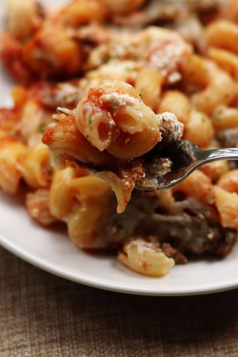 Crock Pot Million Dollar Pasta--an easy crockpot dinner made with ground beef, cavatappi pasta, spaghetti sauce and a creamy layer of cream cheese, sour cream and ricotta.
