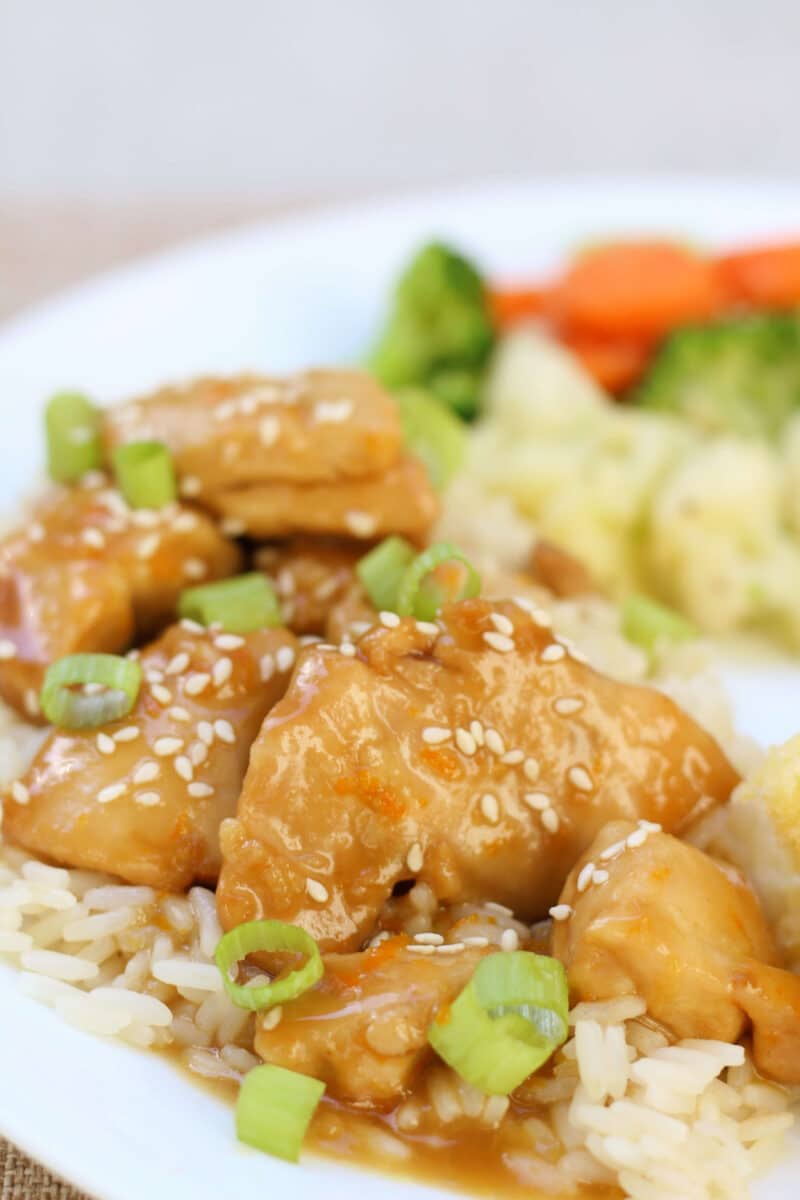 Hayden's California Orange Chicken--an easy slow cooker dinner made with tender chicken thighs, fresh orange juice, ginger and garlic for a simple, flavorful take on orange chicken.