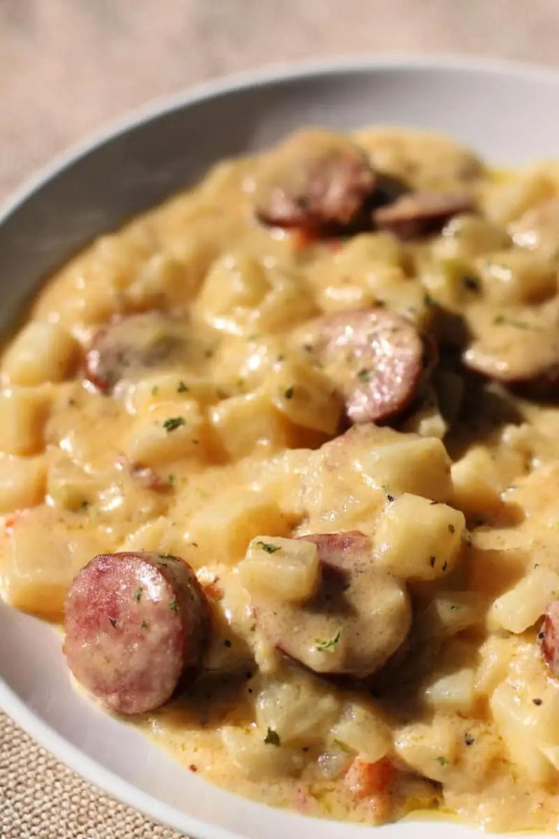 Slow Cooker Cheesy Kielbasa Hashbrown Casserole--an easy dump-and-go dinner made with smoky kielbasa, frozen hashbrown potatoes, cheddar cheese and a creamy sauce.