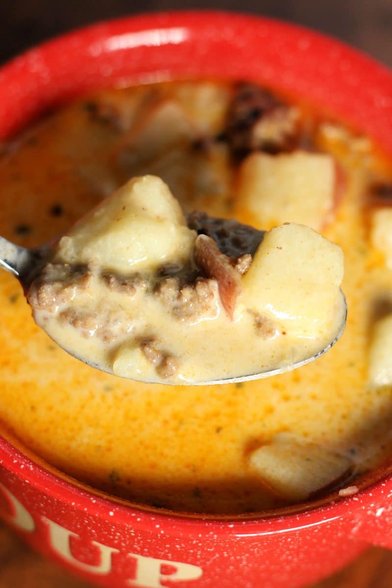 Cheesy Beef and Potato Soup--an easy soup made with ground beef, tender red potatoes and cheddar cheese in a creamy broth. Make it in the Instant Pot or slow cooker.