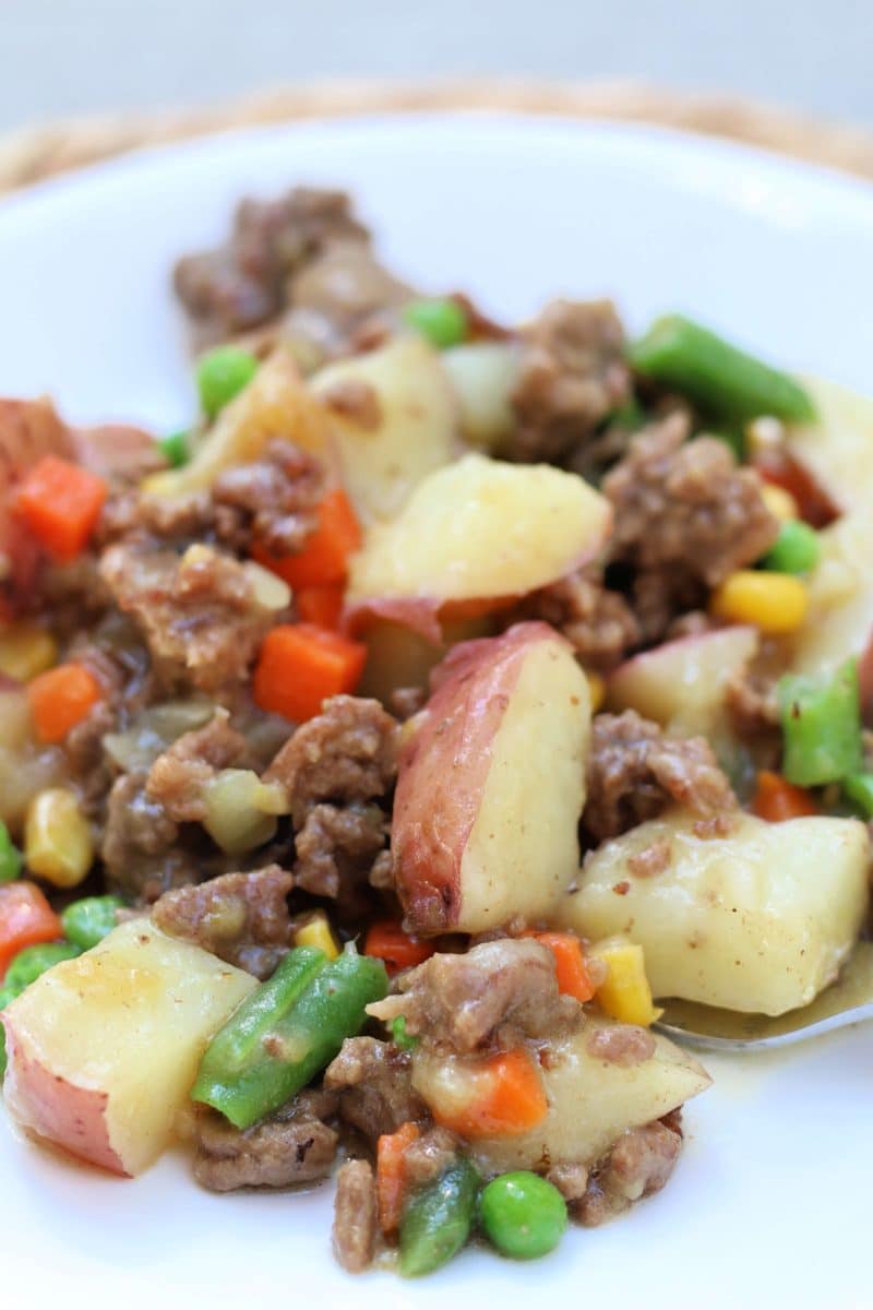 Country Beef Potato Gravy Casserole--a fast and easy Instant Pot or slow cooker dinner of seasoned ground beef, tender red potatoes, mixed vegetables and a savory chicken gravy that brings everything together.