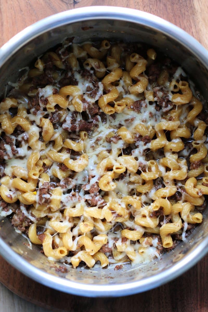 French Onion Ground Beef Pasta Gratin--an easy Instant Pot meal made with ground beef, tender pasta, French onion soup, thyme and melted Gruyere cheese for a comforting French onion soup inspired pasta dinner.