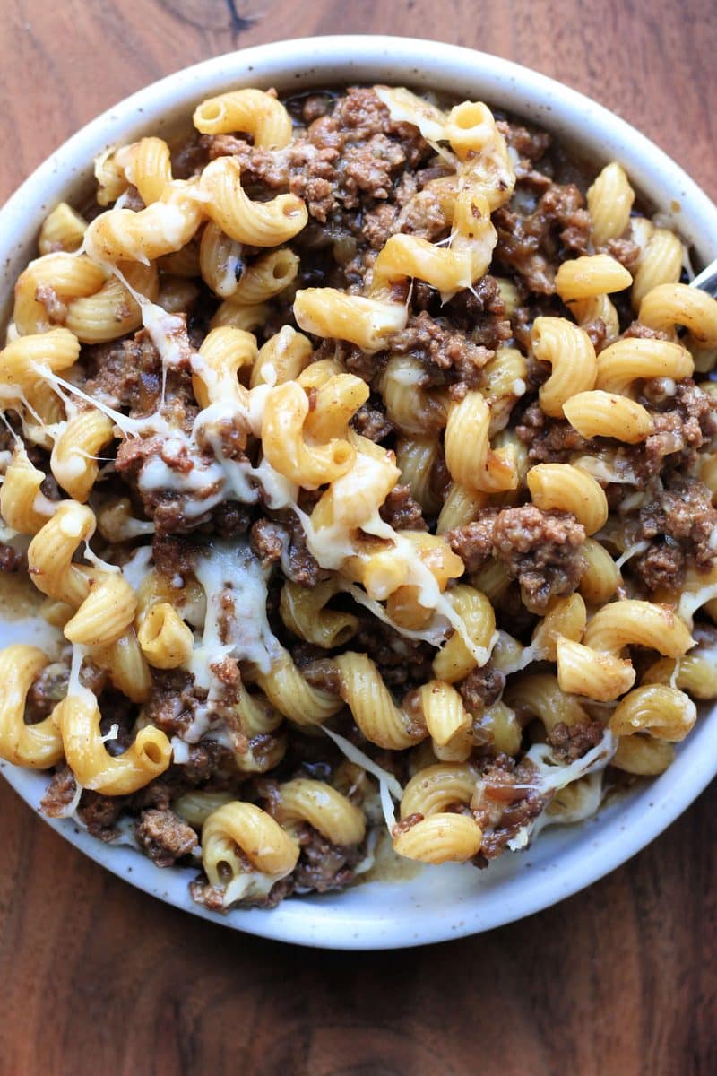 French Onion Ground Beef Pasta Gratin--an easy Instant Pot meal made with ground beef, tender pasta, French onion soup, thyme and melted Gruyere cheese for a comforting French onion soup inspired pasta dinner.