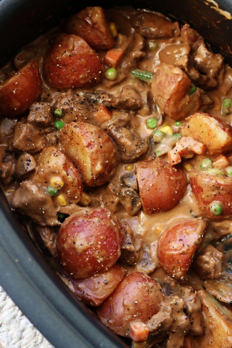 Slow Cooked Steak Diane Casserole--an easy crockpot dinner made with tender beef, red potatoes and mushrooms in a rich gravy that's finished off with a splash of cream.