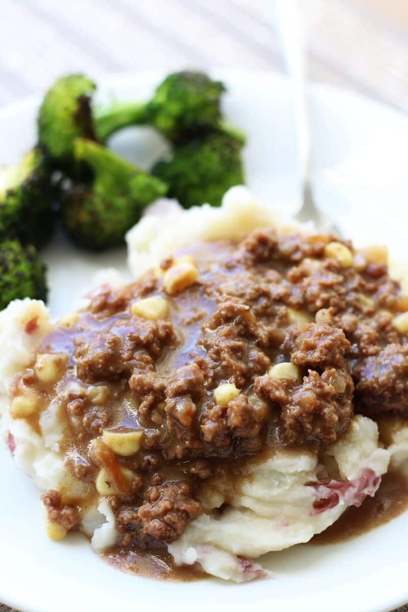 Southern Hamburger Onion Gravy Casserole--an easy dinner made with seasoned ground beef, corn and a savory onion gravy served over creamy homemade mashed potatoes, all cooked in one pot!
