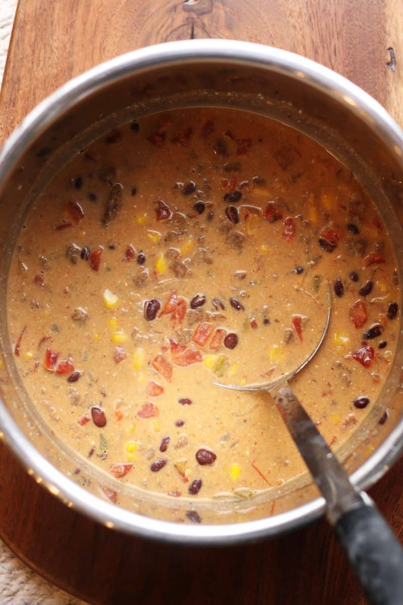 Southern Santa Fe Ground Beef Soup--an easy soup made with ground beef, black beans, pinto beans, corn, Rotel tomatoes, ranch seasoning and cream cheese for a rich and flavorful taco-inspired soup.
