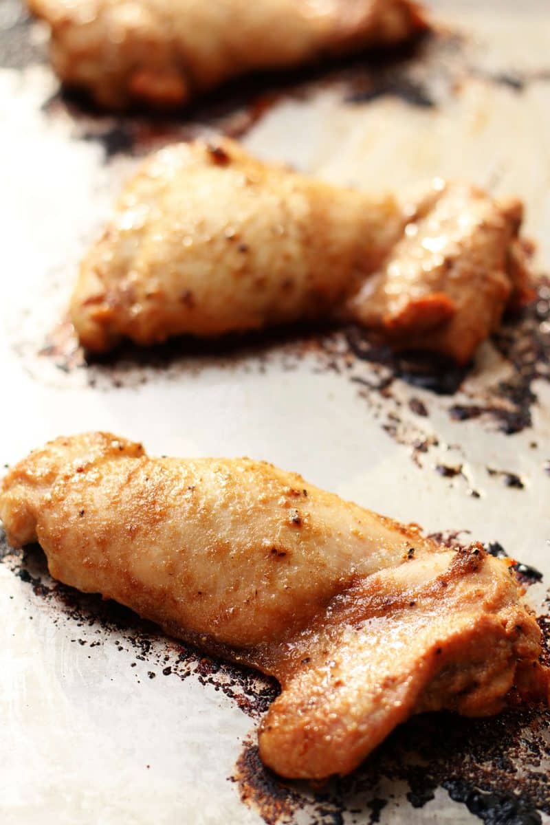Tender, juicy oven-baked chicken thighs marinated in soy sauce, sesame oil, garlic, ginger, lemon juice and brown sugar for an easy, flavorful chicken dinner.