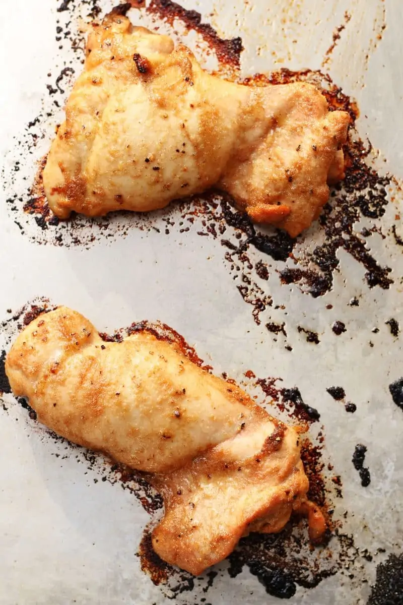 Tender, juicy oven-baked chicken thighs marinated in soy sauce, sesame oil, garlic, ginger, lemon juice and brown sugar for an easy, flavorful chicken dinner.