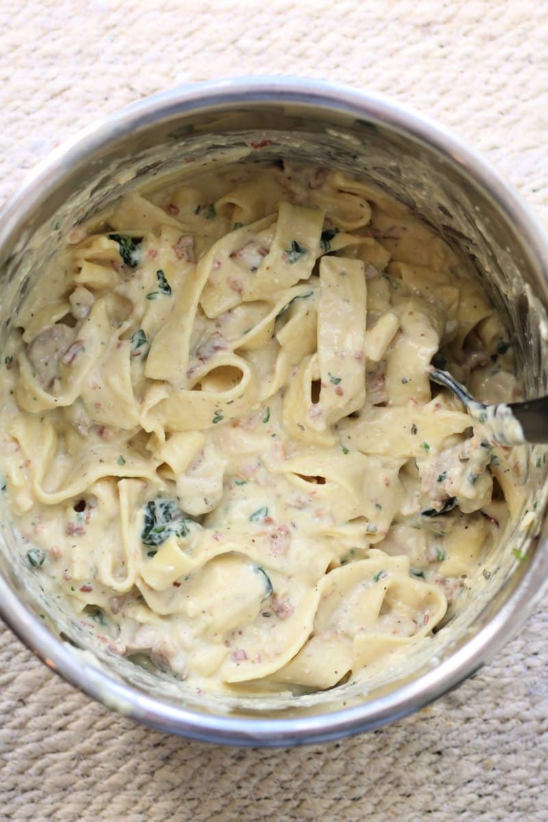 The Crazy Amazingly Good Casserole--an easy Instant Pot dinner made with tender chicken, wide noodles, bacon, ranch seasoning, spinach and a creamy parmesan sauce.
