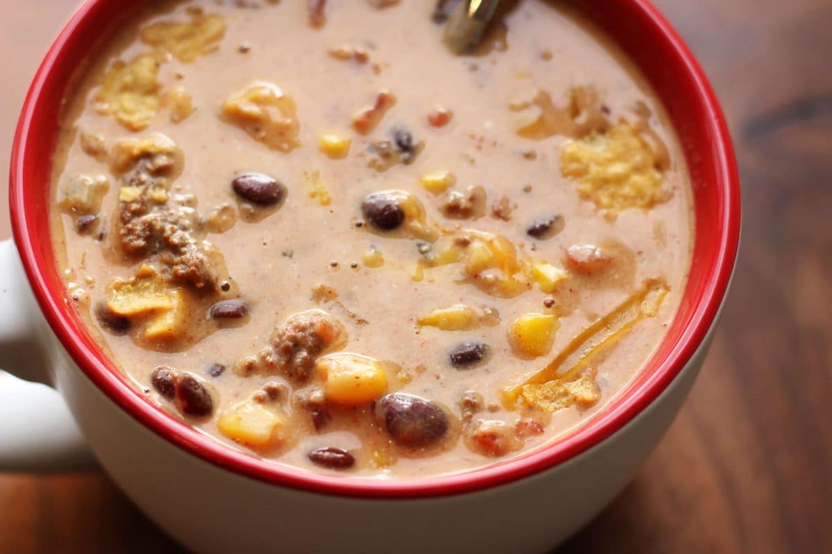 Southern Santa Fe Ground Beef Soup--an easy soup made with ground beef, black beans, pinto beans, corn, Rotel tomatoes, ranch seasoning and cream cheese for a rich and flavorful taco-inspired soup.