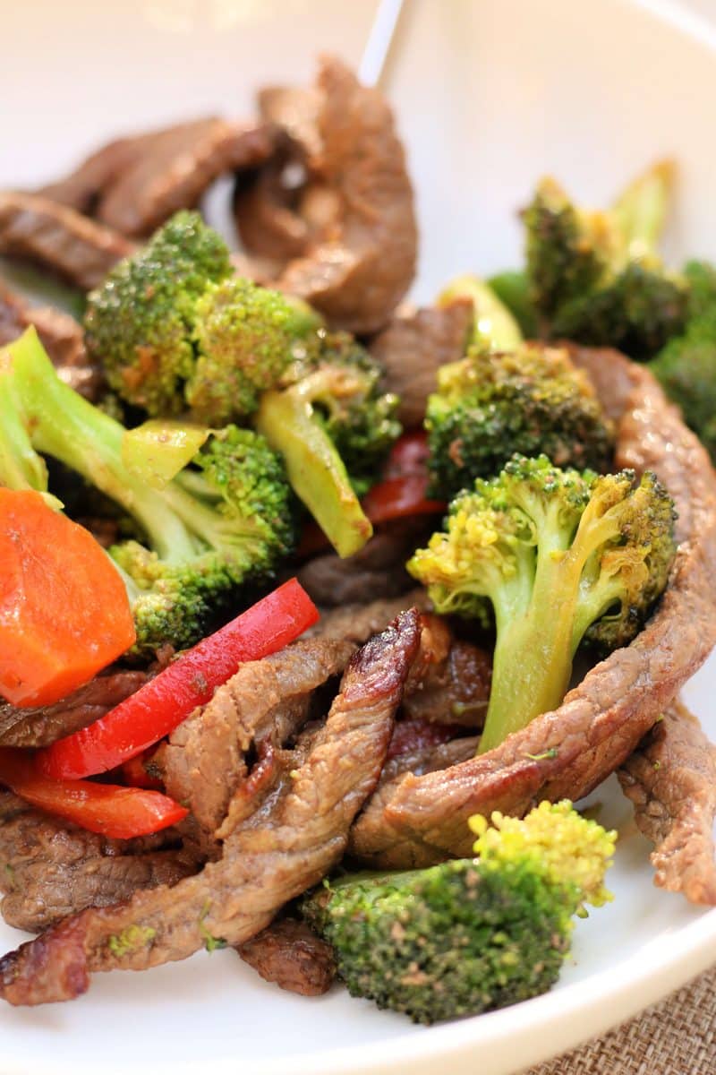easy beef and broccoli stir fry that is a quick 20-minute dinner made with tender strips of sirloin, crisp vegetables and a simple savory soy sauce.