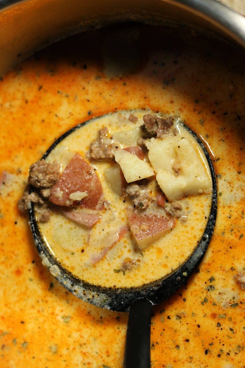 Cheesy Beef and Potato Soup--an easy soup made with ground beef, tender red potatoes and cheddar cheese in a creamy broth. Make it in the Instant Pot or slow cooker.