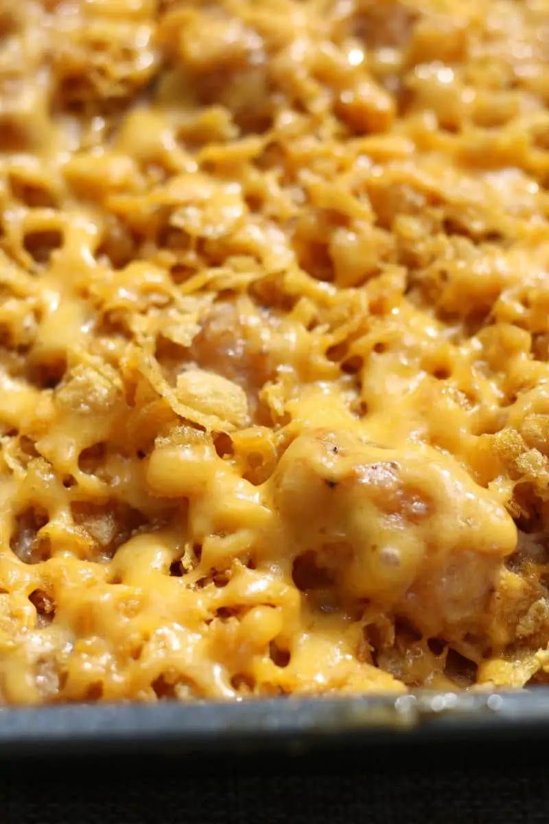 An easy side dish made with frozen tater tots, cream of mushroom soup, sour cream and cheddar cheese, topped with buttery, crunchy cornflakes. Make it in the oven or slow cooker!