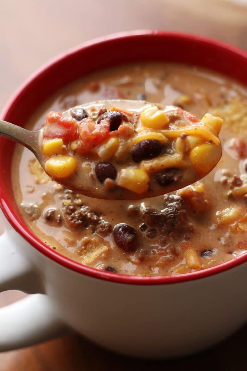 Southern Santa Fe Ground Beef Soup--an easy soup made with ground beef, black beans, pinto beans, corn, Rotel tomatoes, ranch seasoning and cream cheese for a rich and flavorful taco-inspired soup.
