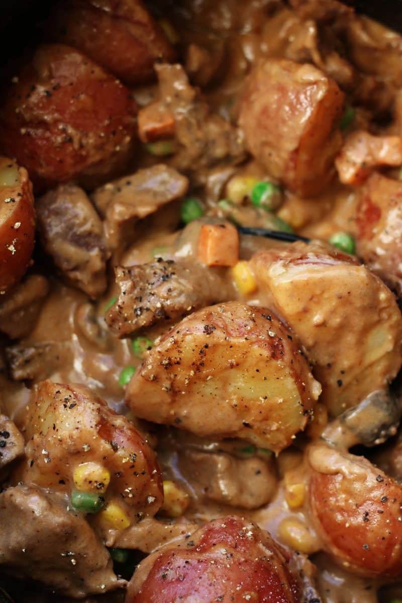Slow Cooked Steak Diane Casserole--an easy crockpot dinner made with tender beef, red potatoes and mushrooms in a rich gravy that's finished off with a splash of cream.