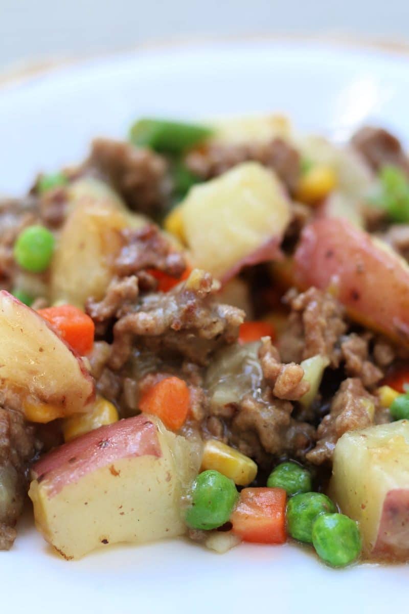 Country Beef Potato Gravy Casserole--a fast and easy Instant Pot or slow cooker dinner of seasoned ground beef, tender red potatoes, mixed vegetables and a savory chicken gravy that brings everything together.