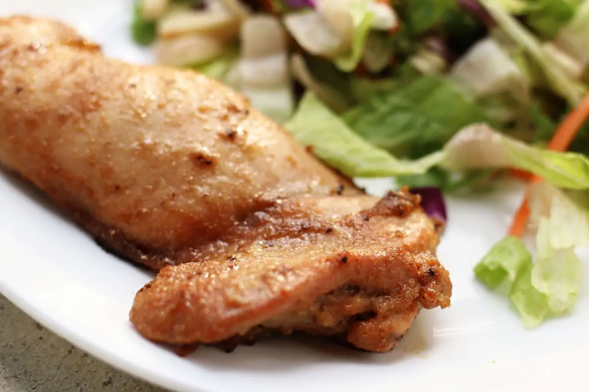 Tender, juicy oven-baked chicken thighs marinated in soy sauce, sesame oil, garlic, ginger, lemon juice and brown sugar for an easy, flavorful chicken dinner.