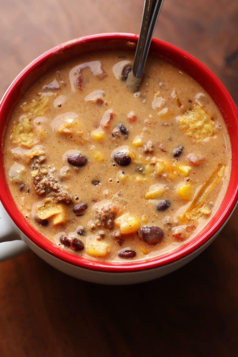 Southern Santa Fe Ground Beef Soup--an easy soup made with ground beef, black beans, pinto beans, corn, Rotel tomatoes, ranch seasoning and cream cheese for a rich and flavorful taco-inspired soup.