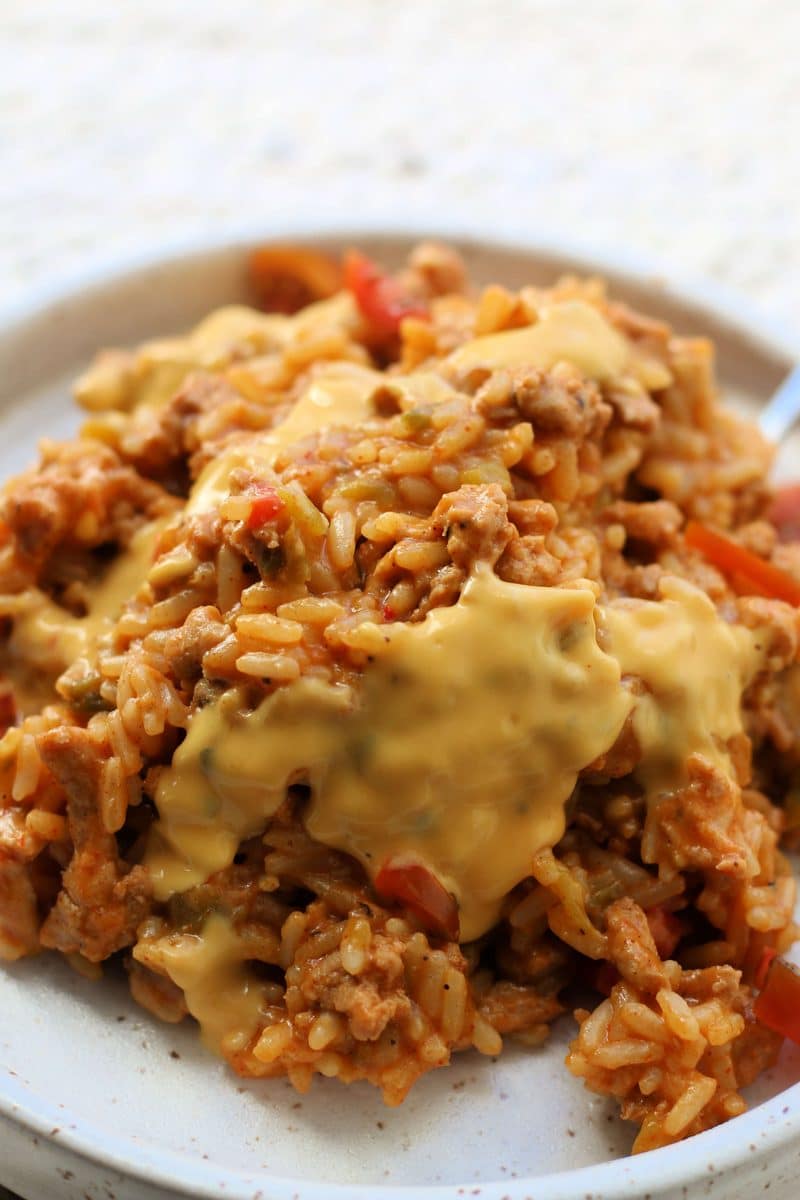 The Best Ever Queso Chicken Casserole--an easy Instant Pot dinner made with ground chicken, rice, green chiles, salsa con queso and plenty of cheesy Tex-Mex flavor.
