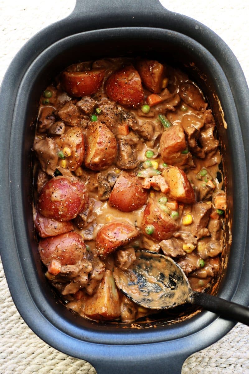 Slow Cooked Steak Diane Casserole--an easy crockpot dinner made with tender beef, red potatoes and mushrooms in a rich gravy that's finished off with a splash of cream.